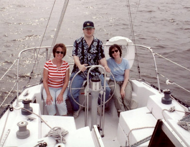 crew at wheel in cockpit