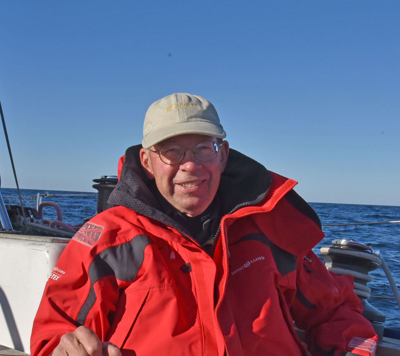 Skipper Aboard SeaRenity in red foulies